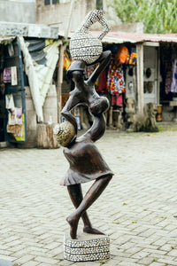 African art home decor includes handcarved wood sculptures Ashanti fertility goddess