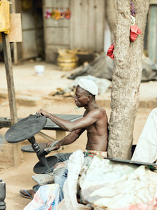 artisan working on his art in Ghana, West Africa