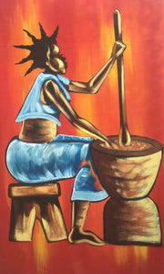 african woman pounding cassava