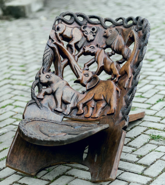 Chair-Ornate folding Chair, hand-carved of dark colour drum wood, Ghana, West Africa Large= 112 cm X 53 cm