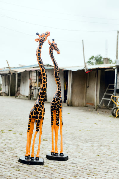 African Wood Sculpture-Gigantic Giraffe, hand-carved of white wood, Ghana, West Africa Smaller of the Pair (on right side in photo) 240 cm X 49 cm