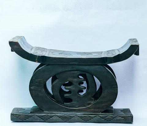 Golden Stool (Black) The Chief Stool is fit for a King or Queen, Adinkra Symbol of 'Nyame ye ohene' (God is King), hand-carved of brown wood, Black Ghana, West Africa 59 cm X 38 cm